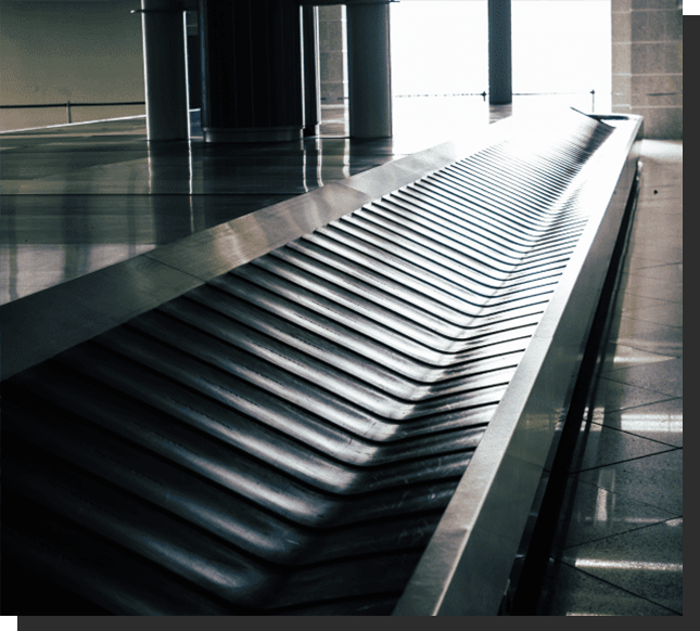 A conveyor belt in the middle of an airport.